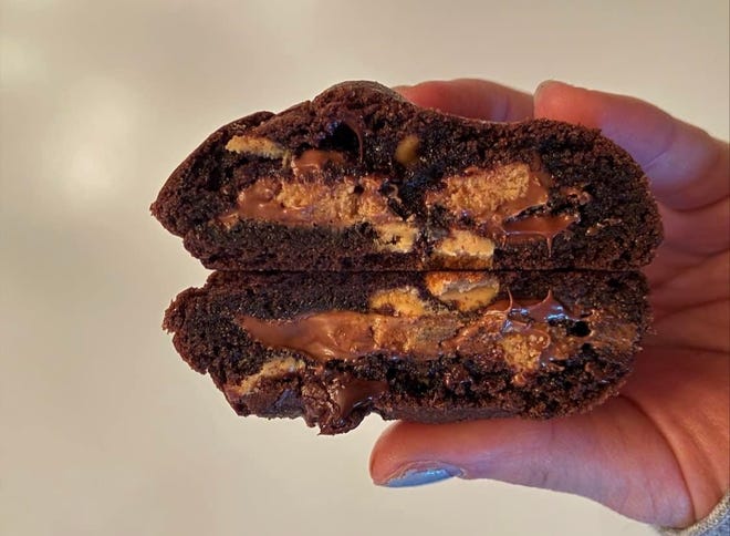Made with peanut butter and chocolate chips and a double chocolate chunk base mixed together with a peanut butter cup in the middle.