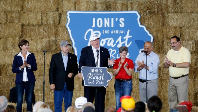 Iowa lawmakers and Republican leaders join Republican presidential candidate Donald Trump (center) on stage Saturday, Aug. 27, 2016, during the second annual Roast and Ride at the Iowa State Fairgrounds in Des Moines.