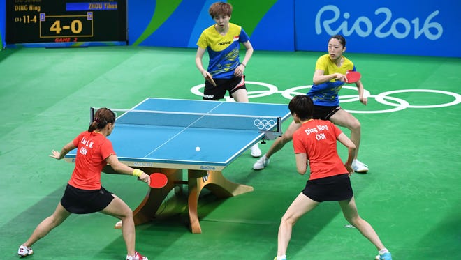Mengyu Yu and Yihan Zhou of Singapore compete against  Shiwen Liu and Ning Ding of China during the women's team semifinals in the Rio 2016 Summer Olympic Games at Riocentro - Pavilion 3.