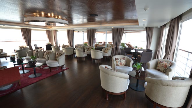 Air conditioned and lined with panoramic windows, the Avalon Myanmar's indoor lounge is located near the front of the vessel.