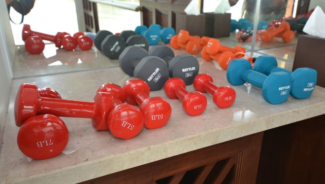 The fitness rooms has a small assortment of free weights.