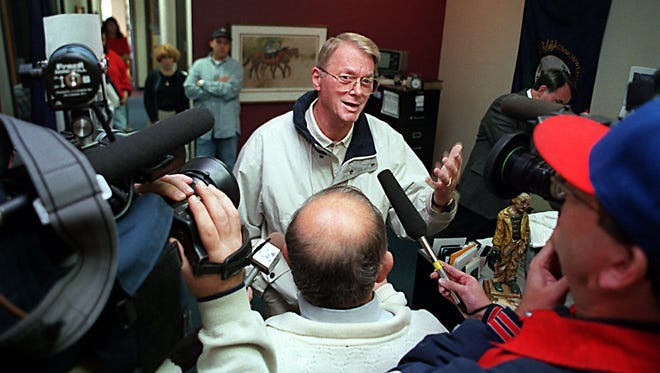 Senator Jim Bunning talks with the media at his campaign office in northern Kentucky on Nov. 4, 1998.