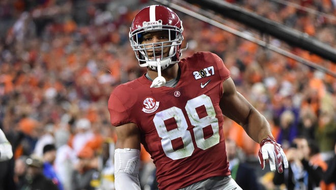 Alabama Crimson Tide tight end O.J. Howard (88) scores a touchdown during the third quarter against the Clemson Tigers in the 2017 College Football Playoff National Championship Game at Raymond James Stadium.