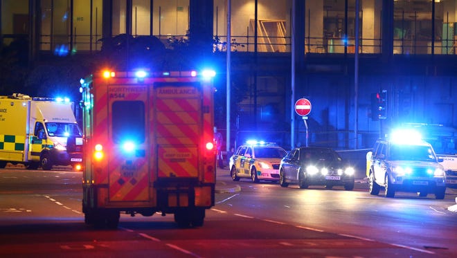 Emergency services arrive near the scene of a possible explosion Tuesday at Manchester Arena during the Ariana Grand concert.