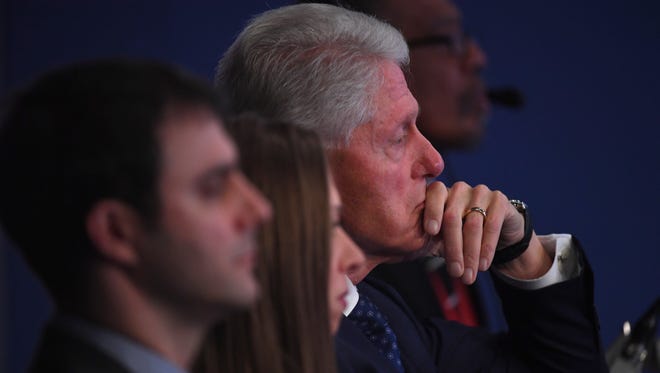 Former President Bill Clinton watches the second presidential debate at Washington University in St Louis.