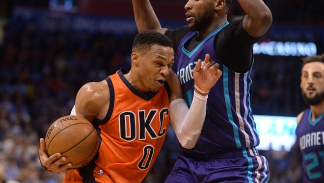 Oklahoma City Thunder guard Russell Westbrook (0) drives to the basket in front of Charlotte Hornets forward Michael Kidd-Gilchrist (14) during the third quarter at Chesapeake Energy Arena.