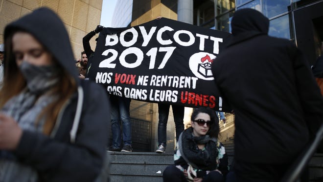 Anti-election activists demonstrate in Paris on April 23, 2017, during the first round of the Presidential election.