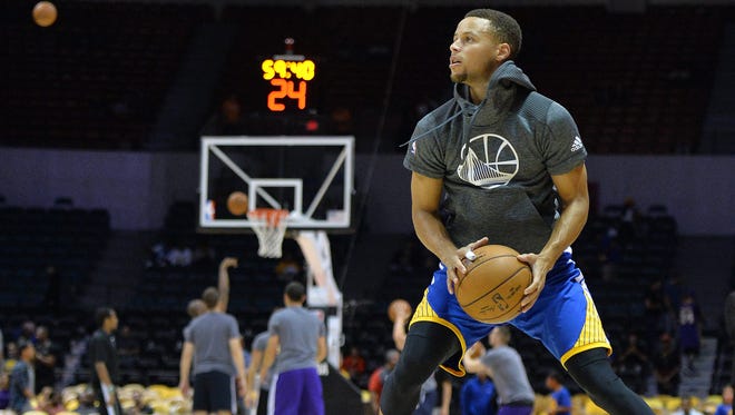 Stephen Curry warms up before a game against the Los Angeles Lakers.