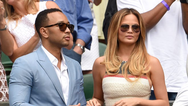 John and Chrissy attend Day 7 at Wimbledon in July 2015.
