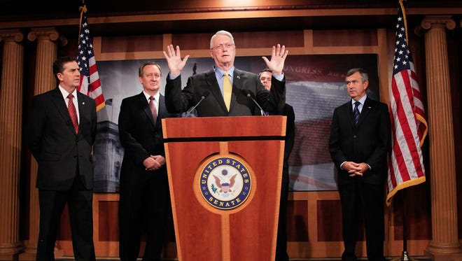 WASHINGTON - OCTOBER 07: Sen. Jim Bunning (R-KY) (C), speaks while flanked by Sen. Jim DeMint (R-SC) (L),  Sen. Michael Crapo (R-ID)(2ndL), Sen. David Vitter (R-LA) (2ndR) and Sen. Mike Johanns (R-NE) during a news conference on Capitol Hill on October 7, 2009 in Washington DC. Senator Bunning spoke about his amendment that would require that the legislative language and a final and complete cost analysis by the Congressional Budget Office be made publicly available on the Finance Committee's website.