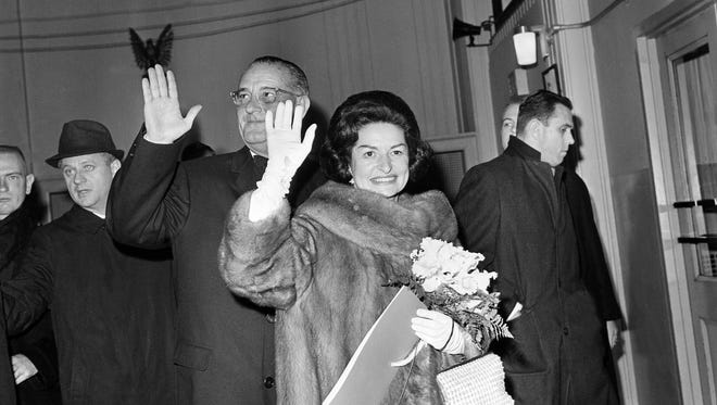 Johnson and his wife, Lady Bird, wave as they leave the inaugural gala held at the National Guard Armory in Washington on Jan. 20, 1965.