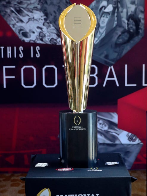 The college football playoff national championship trophy is displayed during the Big 12 Media Days at Omni Dallas Hotel.