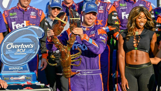 Denny Hamlin, who admitted after the victory lane celebration he has a lobster phobia, celebrates his first NASCAR Cup win of the season.