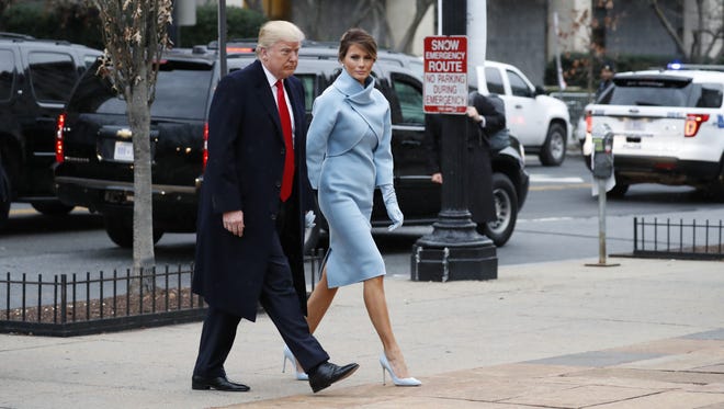 President-elect Donald Trump and his wife Melania arrives for a church service at St. Johns Episcopal Church across from the White House in Washington.