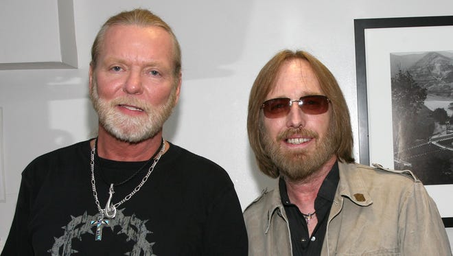 Gregg Allman and Tom Petty pose backstage before they perform in concert with the Allman Brothers Band at the Greek Theater on May 19, 2009, in Los Angeles, Calif.