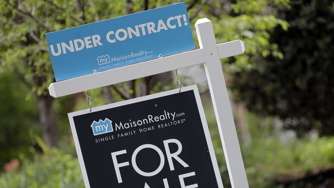 An "Under Contract" sign is posted in front of a home for sale in Charlotte, N.C.
