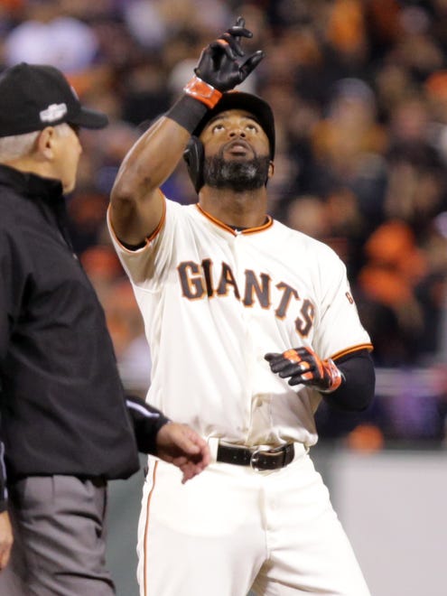 Game 3 in San Francisco: Giants center fielder Denard Span reacts after hitting a double in the third inning.