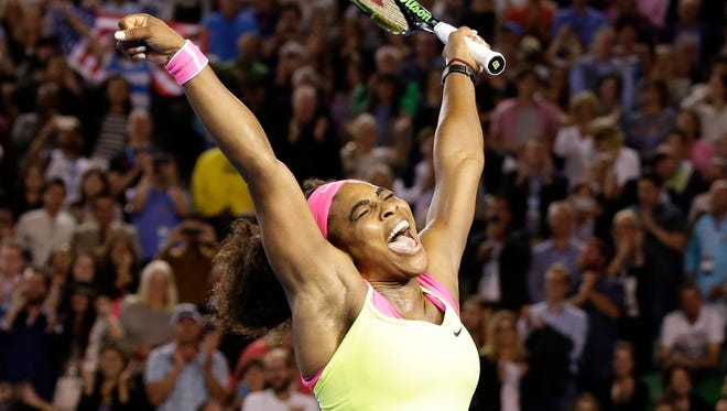 Serena Williams jubilates after winning the 2015 Australian Open women's singles final against Maria Sharapova of Russia.
