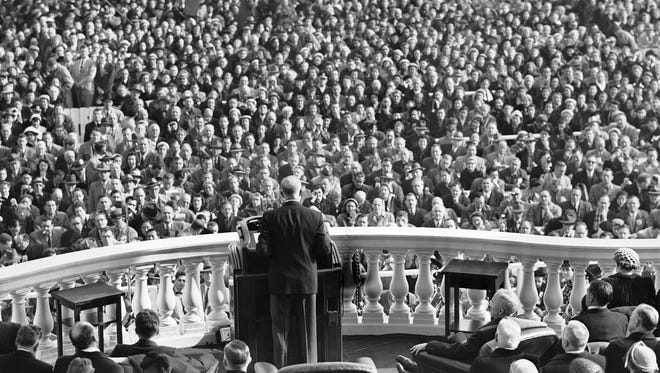 Spectators listen as President Dwight D. Eisenhower delivers his inaugural address on Jan. 20, 1953.