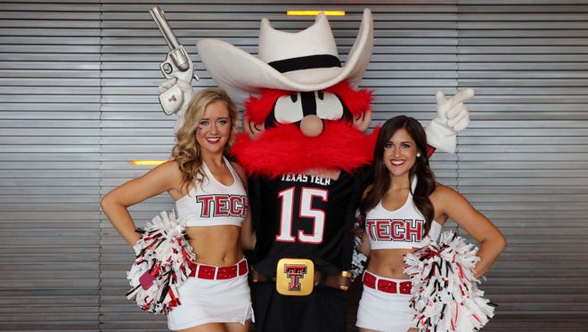 Texas Tech Red Raiders cheerleaders and mascot pose for a photo during the Big 12 Media Days at Omni Dallas Hotel.
