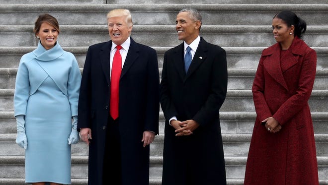 President Donald Trump and former president Obama stand on the steps of the  U.S. Capitol with First Lady Melania and Michelle  in Washington, DC.