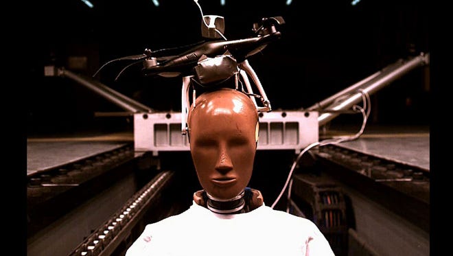Ouch! A crash test  dummy gets hit in its "head" by a drone.