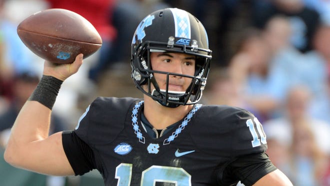 North Carolina Tar Heels quarterback Mitch Trubisky (10) throws a pass during the second half against the North Carolina State Wolfpack at Kenan Memorial Stadium.