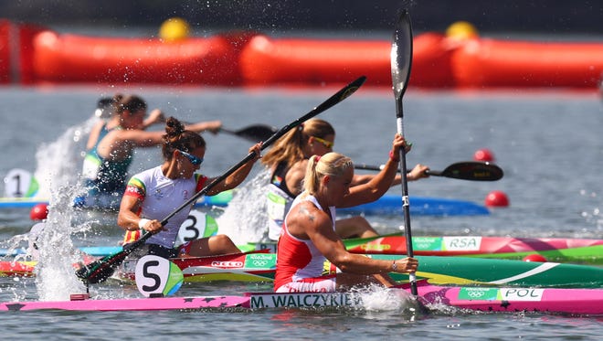 Competitors paddle during women's kayak 200-meter single semifinal during canoe sprint competition in the Rio 2016 Summer Olympic Games at Lagoa Stadium.