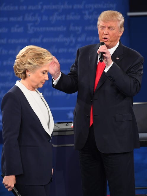 Democratic presidential candidate Hillary Clinton and Republican presidential candidate Donald Trump speak during the second presidential debate at Washington University in St Louis.