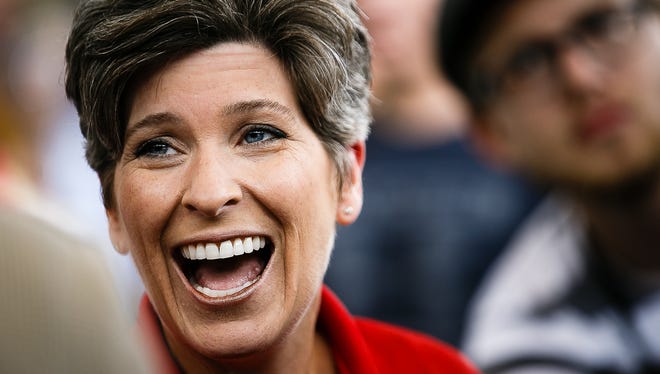 Sen. Joni Ernst arrives and talks to the press at her Roast and Ride at the Iowa State Fairgrounds on Saturday, August 27, 2016 in Des Moines.