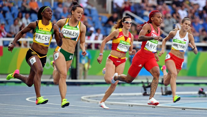 Michelle-Lee Ayhe of Trinidad and Tobago  leads during the women's 200m preliminaries in the Rio 2016 Summer Olympic Games at Estadio Olimpico Joao Havelange.