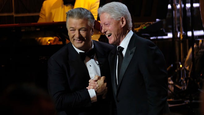 Alec Baldwin, left, and and former president Bill Clinton attend Spike TV's 'One Night Only: Alec Baldwin' at the Apollo Theater on Sunday, night in New York.