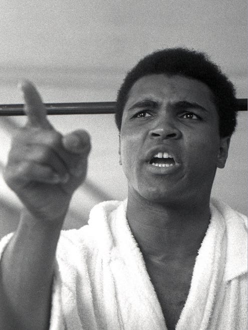 Ali addresses the media during an interview session at the 5th Street Gym in Miami Beach following his training workout for his world heavyweight title bout with Joe Frazier in 1971.