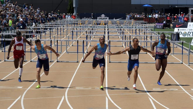 Aleec Harris (second from right) edges Aries Merritt (center) and Devon Allen to win the 110 hurdles. w