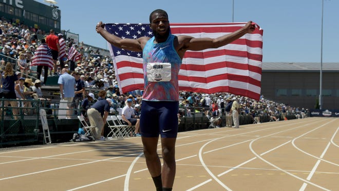 Ameer Webb celebrates after winning the 200 in 20.09.