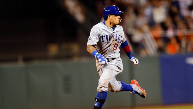 Game 4 in San Francisco: Cubs third baseman Javier Baez heads to third base after a throwing error during the fifth inning.