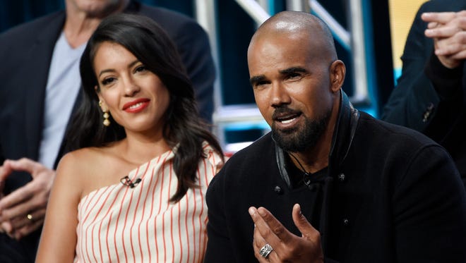 Shemar Moore, right, discusses the CBS series 'S.W.A.T.' as fellow cast member Stephanie Sigman looks on.