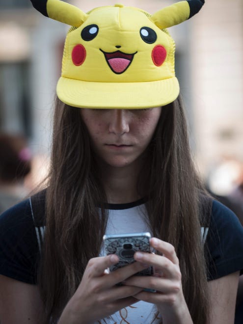 Skip the Pikachu look and go for the Pokemon Go addict. The costume is simple: Get silly gamer hat, glue phone to hand, don't look up even if you're walking into random people and doors at your Halloween party.