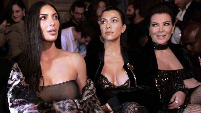 Kim Kardashian, Kourtney Kardashian and their mother Kris Jenner at a fashion show in Paris, Sept. 29, 2016.
Reality television star Kim Kardashian was held at gunpoint on October 2, 2016 at a Paris hotel by assailants disguised as police officers, a spokesperson said. / AFP PHOTO / ALAIN JOCARDALAIN JOCARD/AFP/Getty Images ORIG FILE ID: AFP_GR4WP