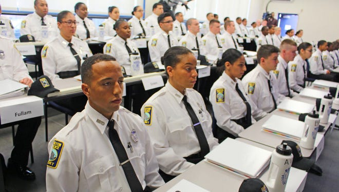 Police cadets prepare for a swearing-in ceremony at Boston's police academy on Nov. 16, 2016.