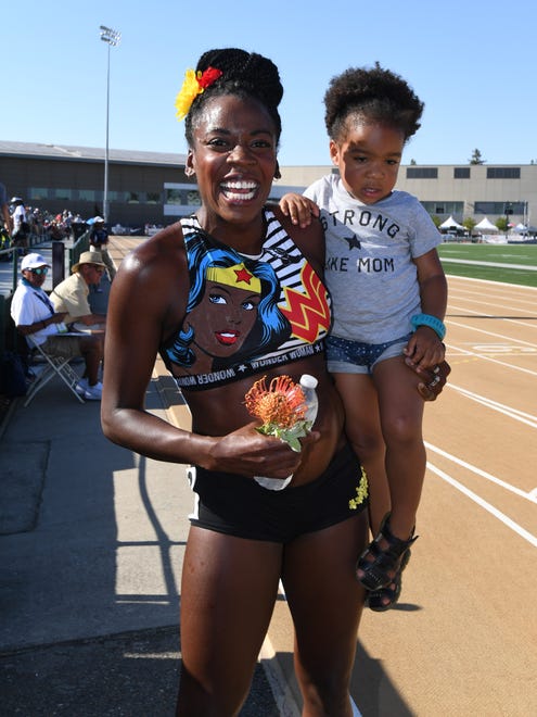 Alysia Montano, with daughter Linnea, after the 800. Montano is four months pregnant.
