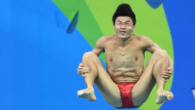 Yuan Cao (CHN) during the men's 3m preliminary springboard round in the Rio 2016 Summer Olympic Games at Maria Lenk Aquatics Centre.