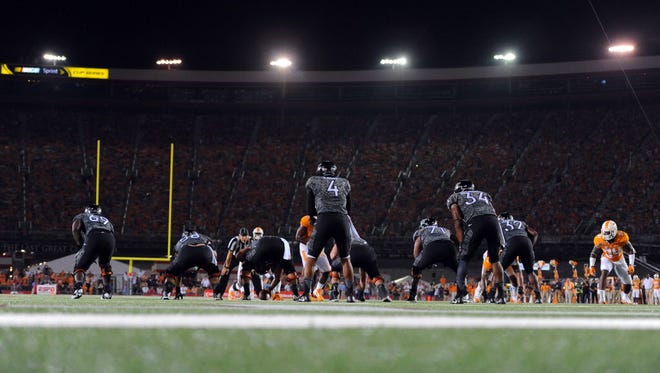 Virginia Tech quarterback Jerod Evans (4) waits for the ball during the first half against Tennessee.