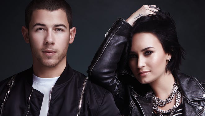Nick Jonas, left, and Demi Lovato will embark on the Honda Civic Tour: Future Now Wednesday in Atlanta.