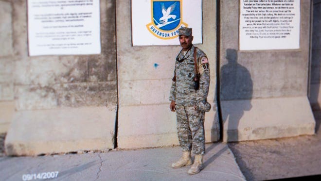 William Thomas, a retired police sergeant and Air Force veteran, appears in a 2007 photograph taken of him in Iraq.