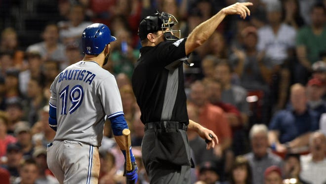 Sept. 25: Home plate umpire Alfonso Marquez ejects Blue Jays right fielder Jose Bautista after arguing a called third strike.