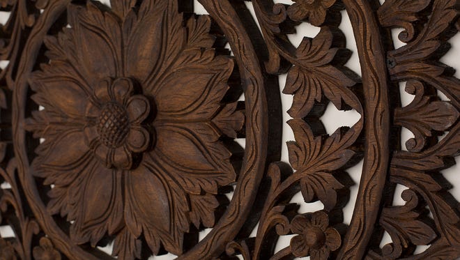 Locally carved teak wood provides the accents on the Avalon Myanmar.