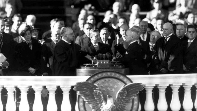 Chief Justice Fred M. Vinson administers the oath of office to Truman in front of the Capitol on Jan. 20, 1949.