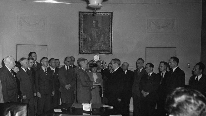 Harry S. Truman is sworn in as president at the White House on April 12, 1945, after Roosevelt's death.