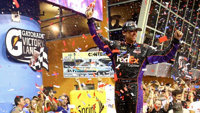 Hamlin celebrates after winning the Ford EcoBoost 400 at Homestead-Miami Speedway.